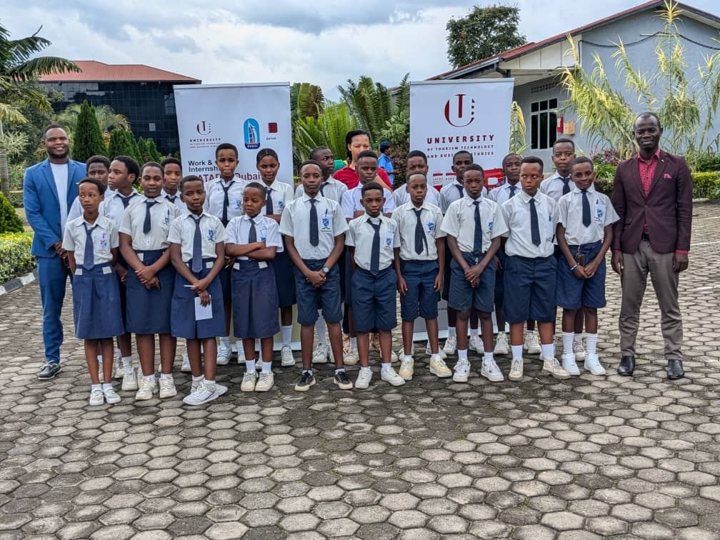 Upper-primary pupils and two teachers on an educational visit to the University of Tourism, Technology and Business Studies